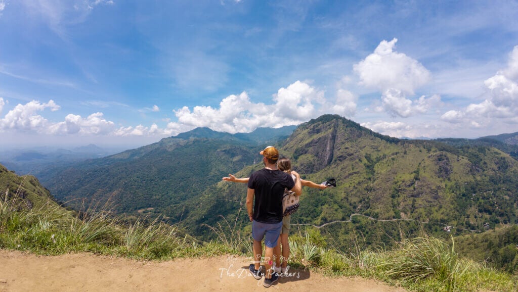 Couple embracing at the summit of Little Adam’s Peak with panoramic views of Sri Lanka’s hill country