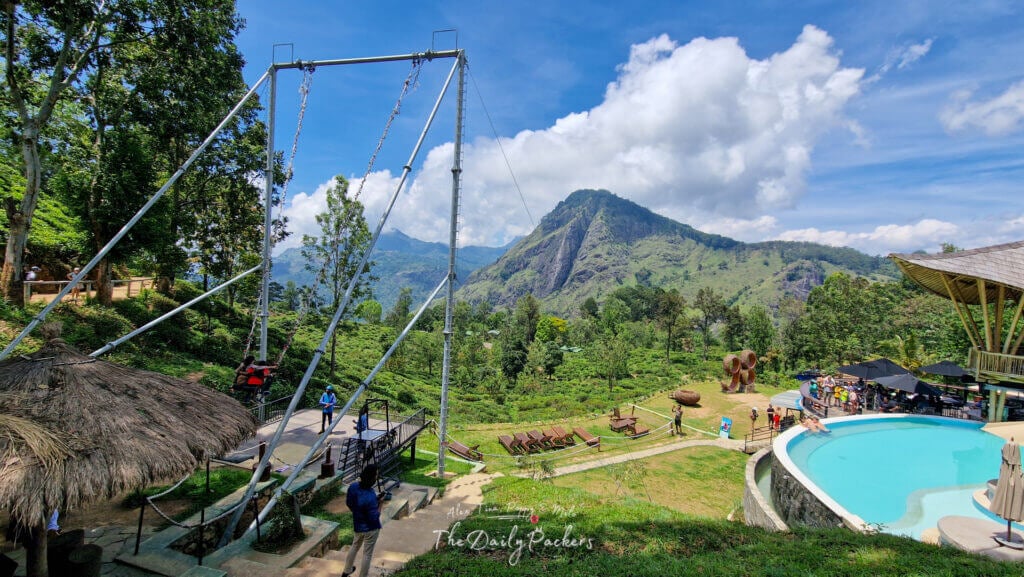 Flying Ravana Mega Swing with a view of Ella’s lush green mountains and a poolside area