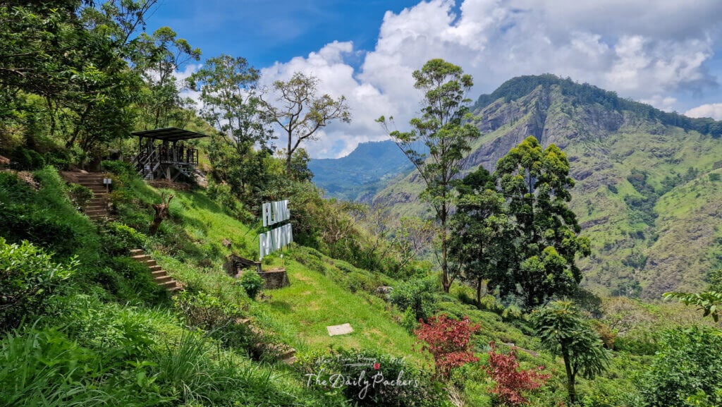 View of Flying Ravana zipline launch platform with tea fields and dramatic peaks in the background