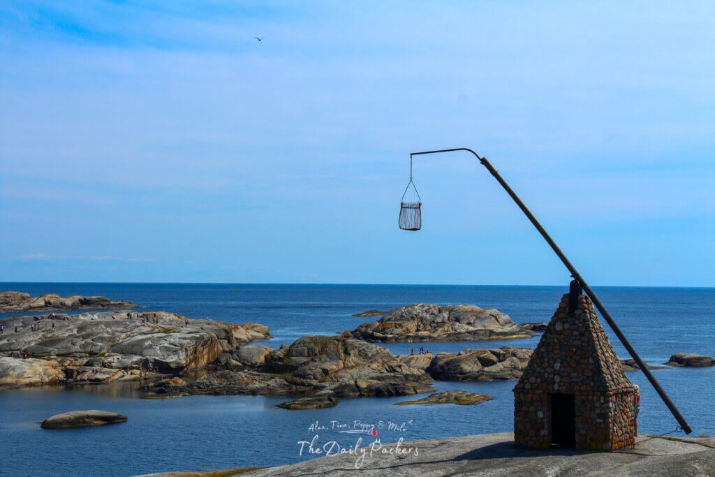 The iconic Vippefyr at Verdens Ende overlooking the rocky coastline and sea.