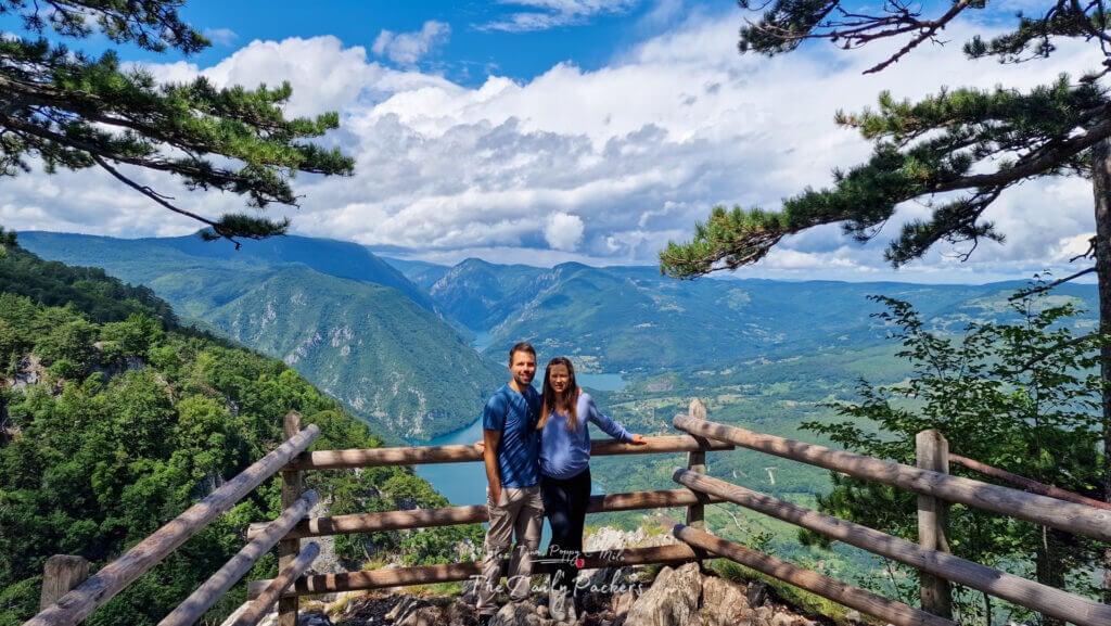 Couple standing at Banjska Stena viewpoint overlooking Tara National Park and the Drina River