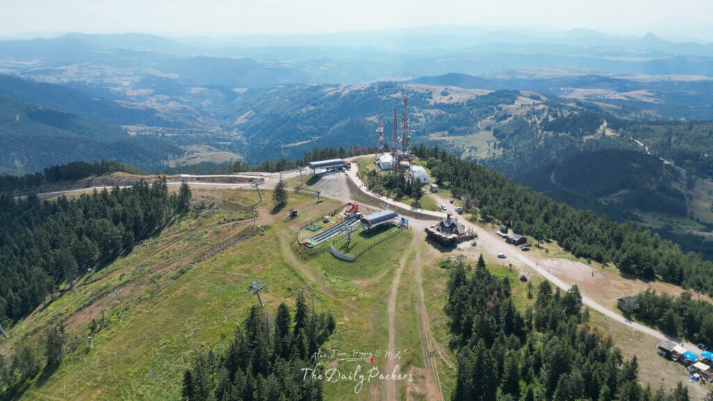 Drone view of the Tornik ski center with forested mountains, chairlifts, and adventure park near Zlatibor