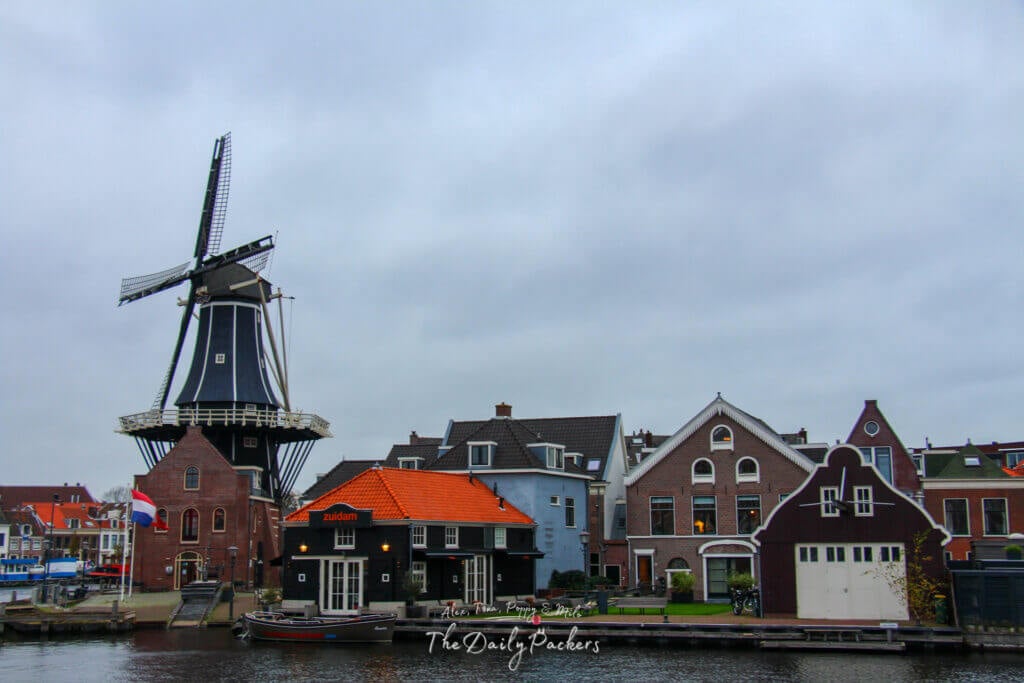 A view of Haarlem’s canal and city from behind a piece of old winching equipment, with the Grote Kerk visible in the distance.