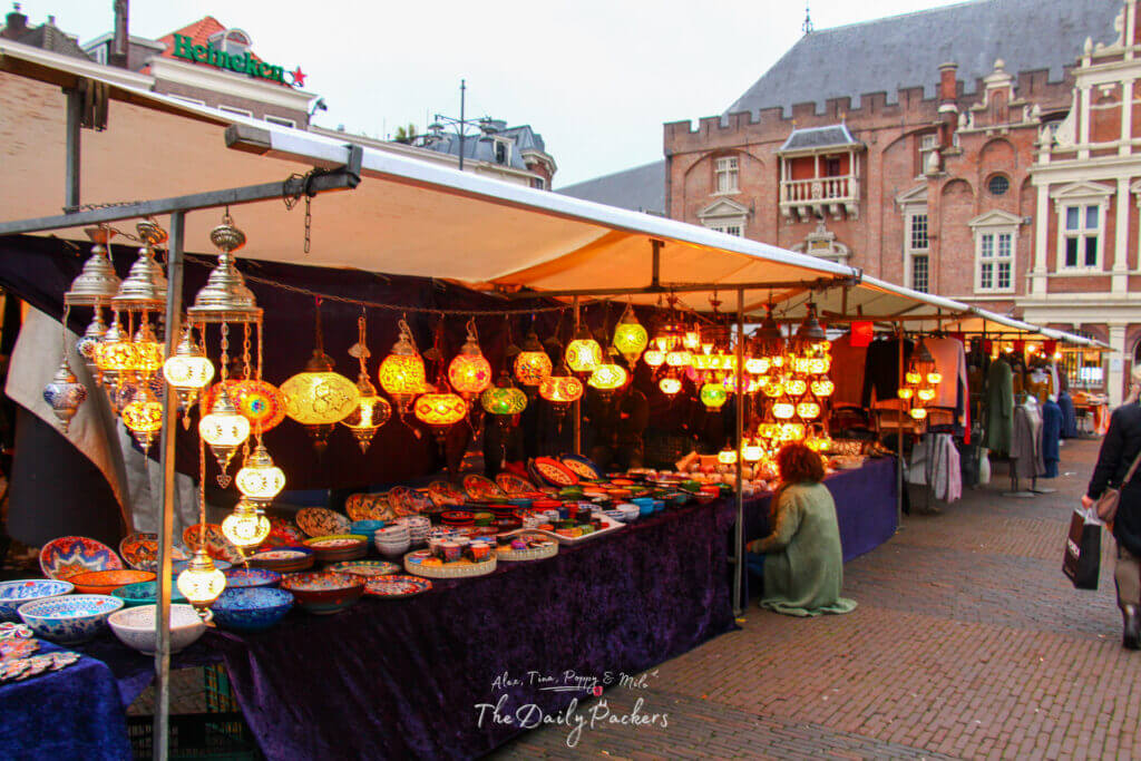 Colorful lanterns and ceramics at a market stall in Haarlem’s Grote Markt