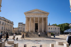 Front view of the Maison Carrée in Nîmes with its tall Corinthian columns and steps