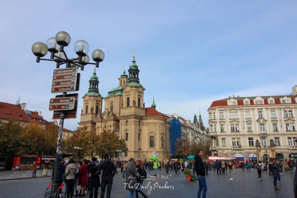 Saint Nicholas Church in Prague’s Old Town Square, with its twin towers and baroque facade seen from the square.