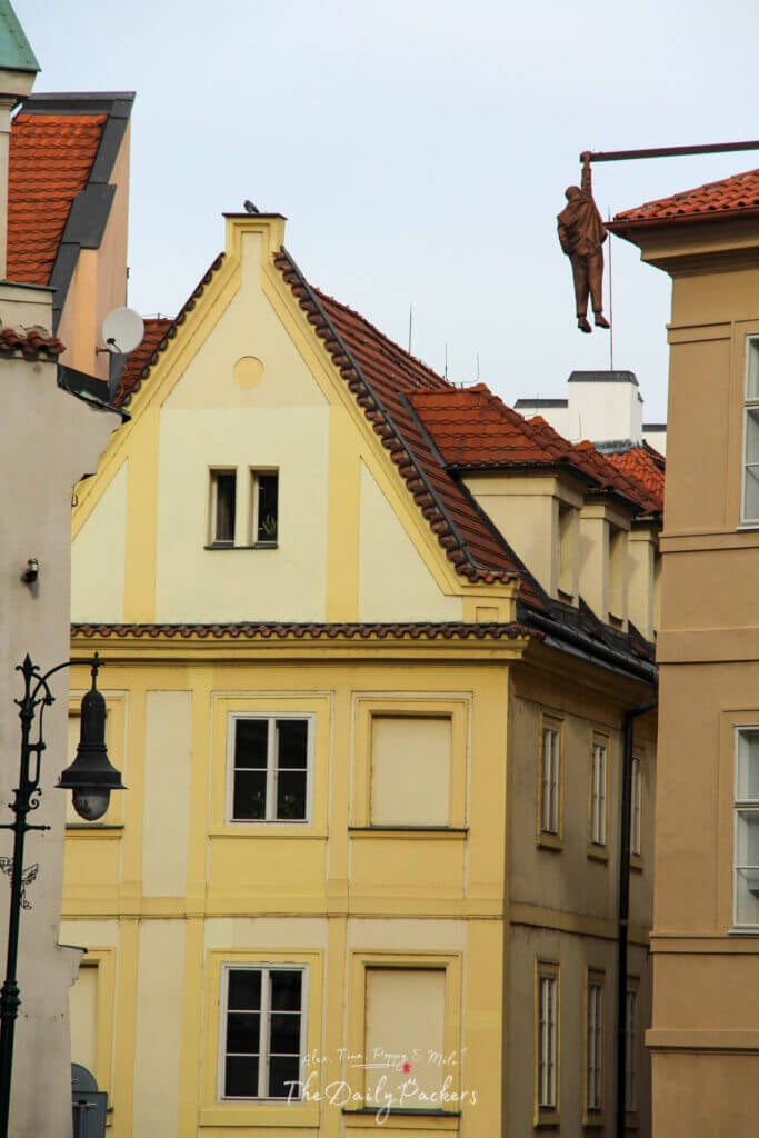 The famous hanging statue of Sigmund Freud by David Černý, suspended above the streets of Prague’s Old Town.