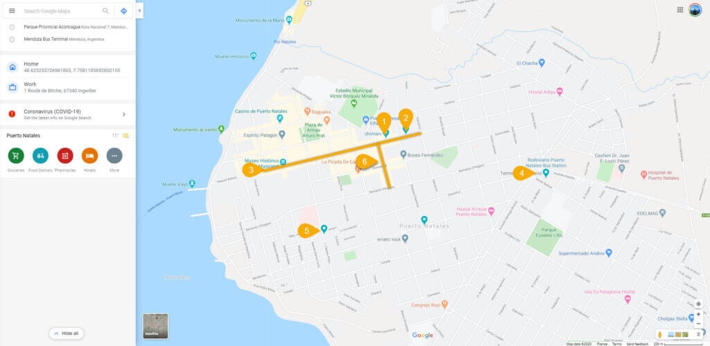 Annotated Google map of Puerto Natales center with highlighted streets and numbered pins showing recommended food and grocery stops.