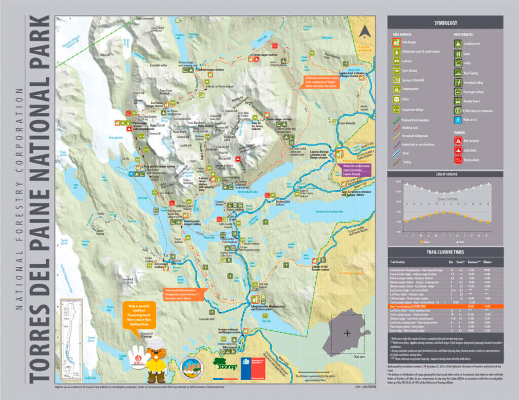 Official Torres del Paine National Park map including trail network, legend of symbols, light‑hours chart, and trail‑closure times