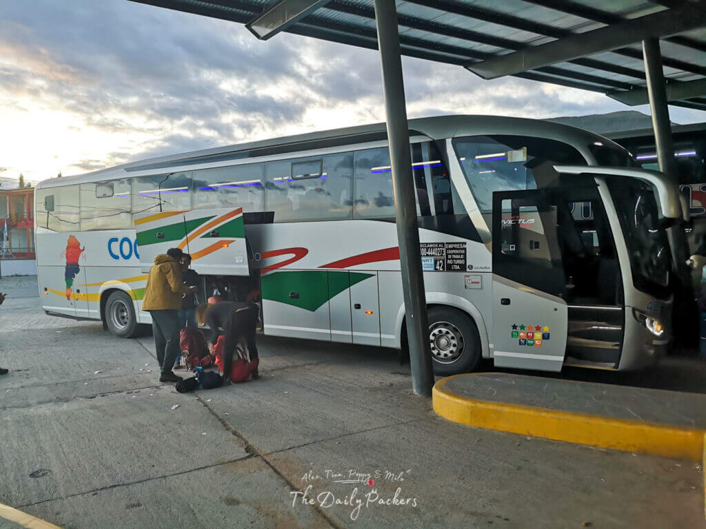 Cootra intercity bus at the terminal with luggage being loaded before the trip to Puerto Natales.