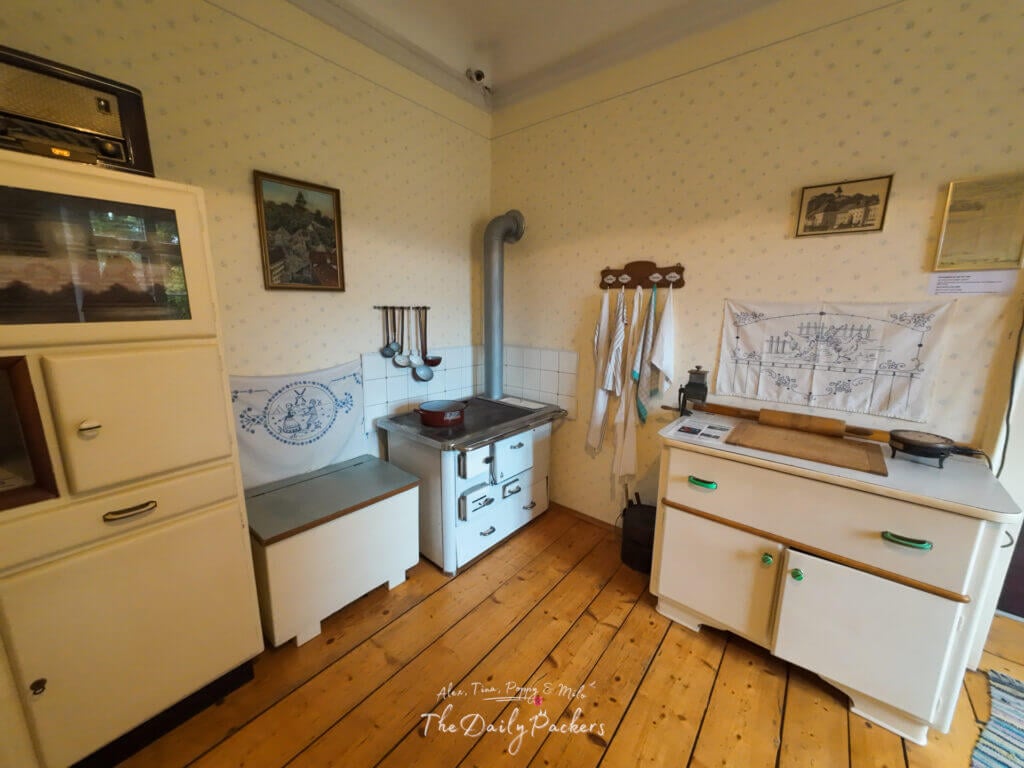 Retro-style kitchen corner with cooking utensils at the Arnold Schwarzenegger Museum.