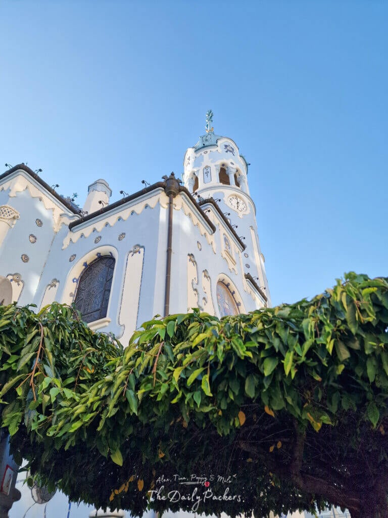 Exterior of the Blue Church in Bratislava with decorative facade and clock tower