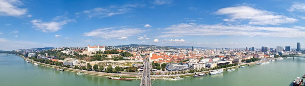 Aerial panoramic view of Bratislava from the UFO Tower featuring the castle, and Danube River