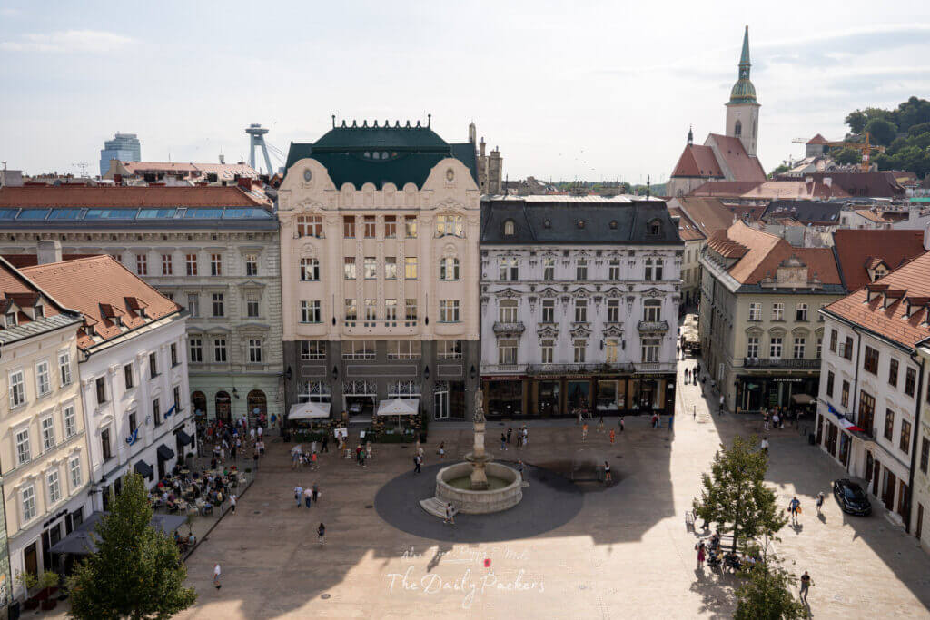 Aerial view of Bratislava’s Main Square with the UFO Tower and St. Martin’s Cathedral in the background.