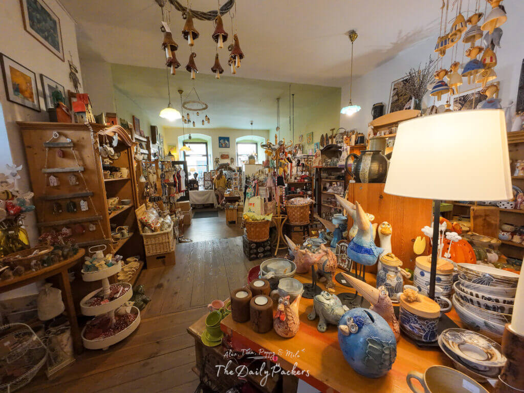 Colorful handmade ceramics, souvenirs, and gifts displayed inside TwiGift shop in Bratislava Old Town.