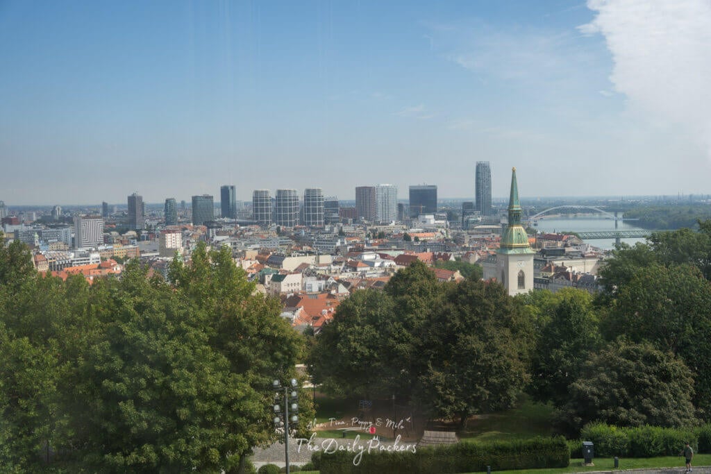 Panoramic view of Bratislava’s old town, modern skyline, and St. Martin’s Cathedral from the castle.