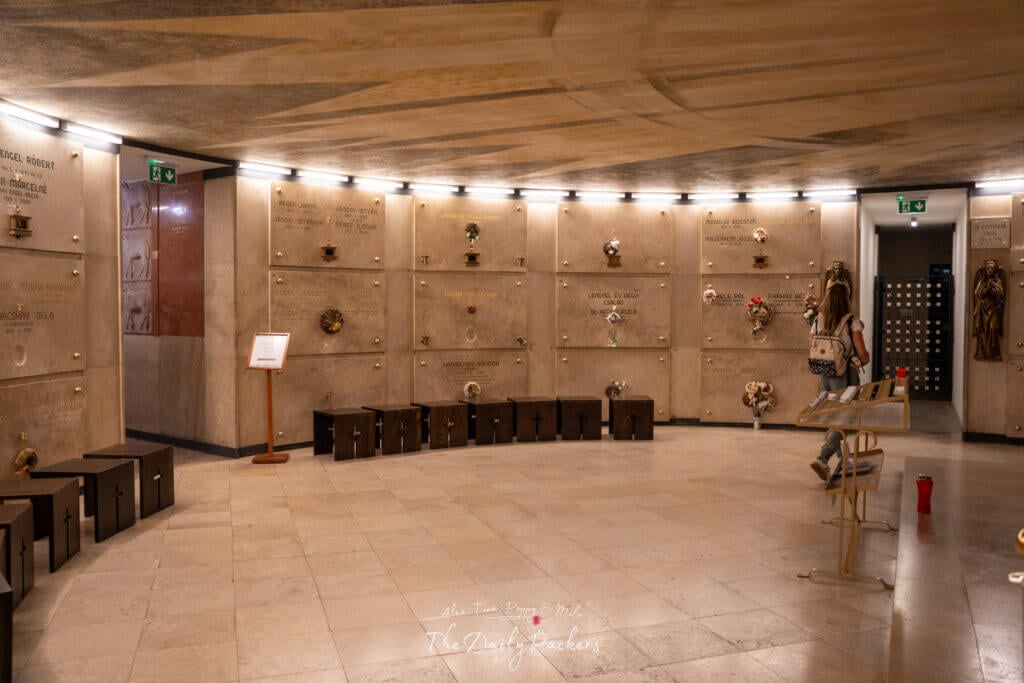 Crypt beneath the Church of the Blessed Virgin Mary in Pécs, showing burial niches and memorial plaques on the walls.