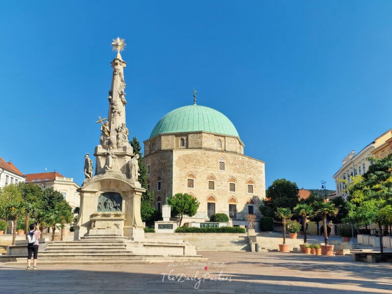 Széchenyi Square in Pécs featuring the mosque of Pasha Qasim, Holy Trinity statue, and the equestrian statue of János Hunyadi