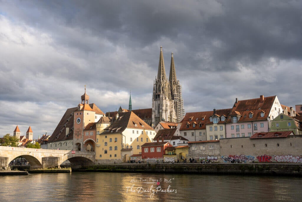 Main panoramic view over Regensburg with the Danube, old bridge, and cathedral towers.