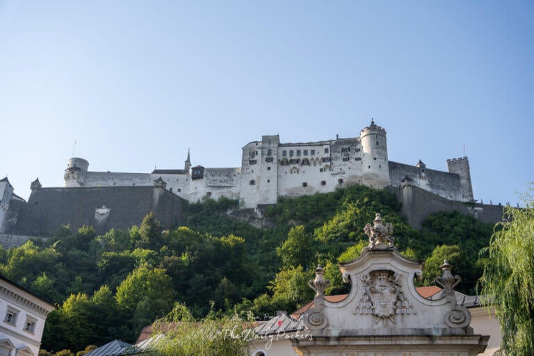 Exterior view of Hohensalzburg Fortress perched on a hilltop above Salzburg with its medieval walls and towers.