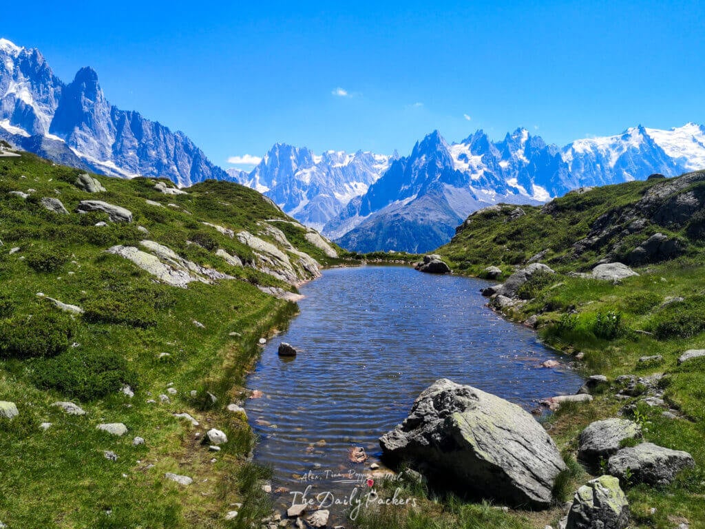 Tiny alpine pond on rolling meadows above Chamonix