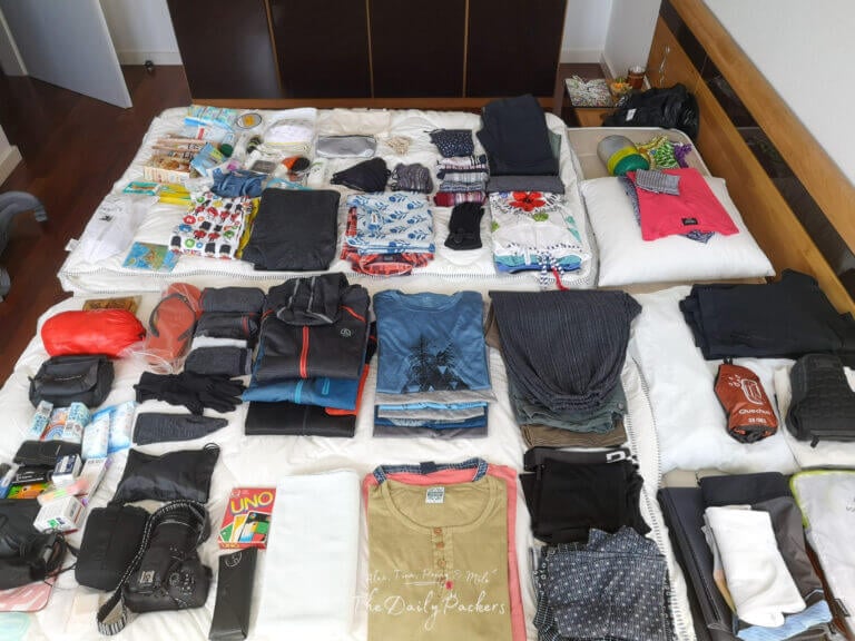 Complete 3-week South America packing list with clothes and essentials spread out on the bed, ready for a 3-week adventure.