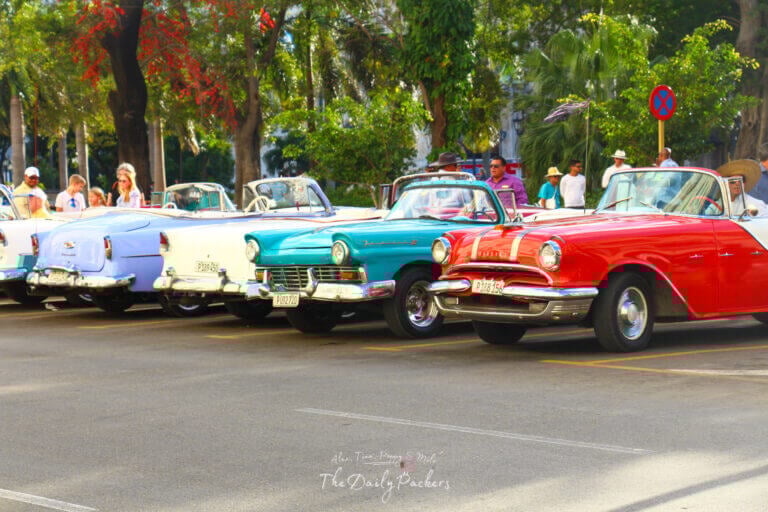 Line of colorful vintage American cars parked in Havana, Cuba a popular attraction for visitors in a Cuba itinerary.