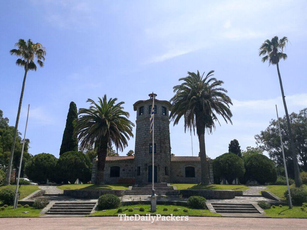 Historic Capatacía building surrounded by palm trees at the entrance of Santa Teresa National Park in Uruguay.