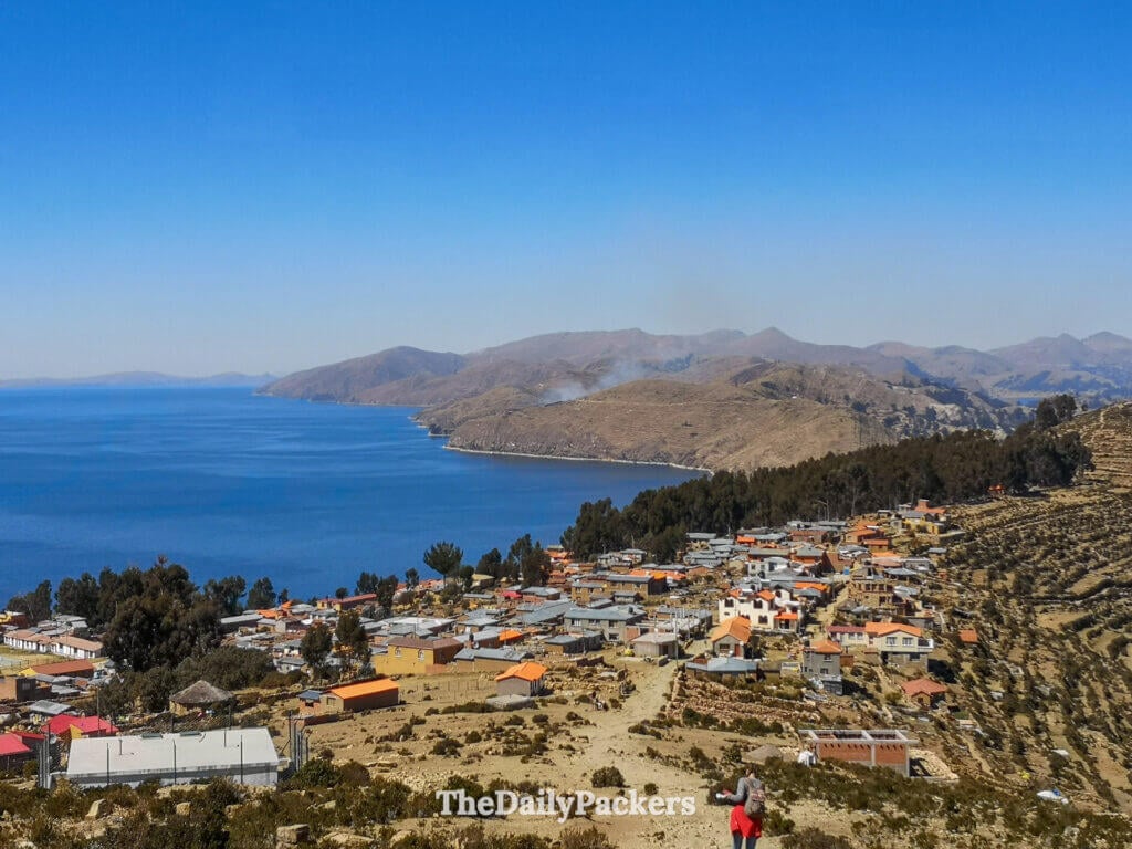 Panoramic view of Isla del Sol showing the terraced hillsides and the deep blue waters of Lake Titicaca