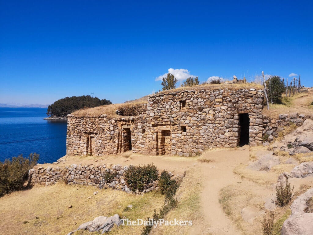 Old stone structure at the Sun Temple on Isla del Sol with wide views over Lake Titicaca and surrounding hills