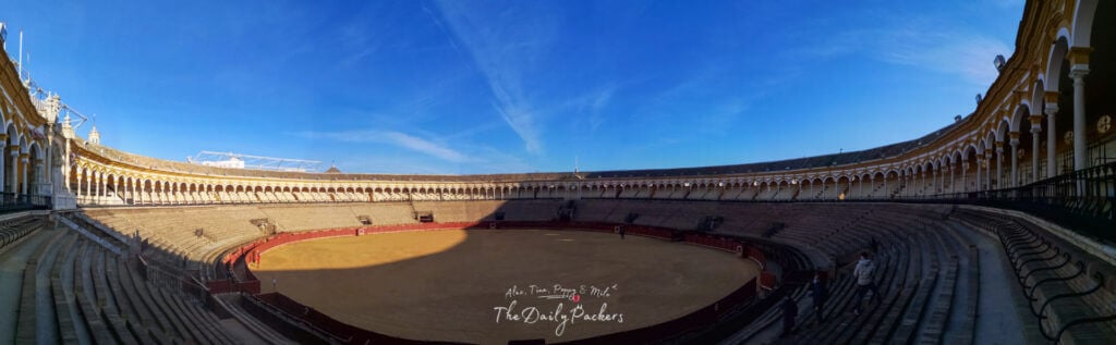 Panoramic view of the Plaza de Toros de la Maestranza showing its symmetrical arches and expansive bullfighting ring.
