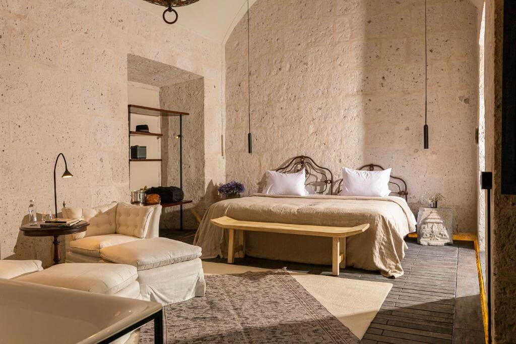 Elegant room at CIRQA Relais & Châteaux in Arequipa, set inside a restored sillar stone building with refined colonial design