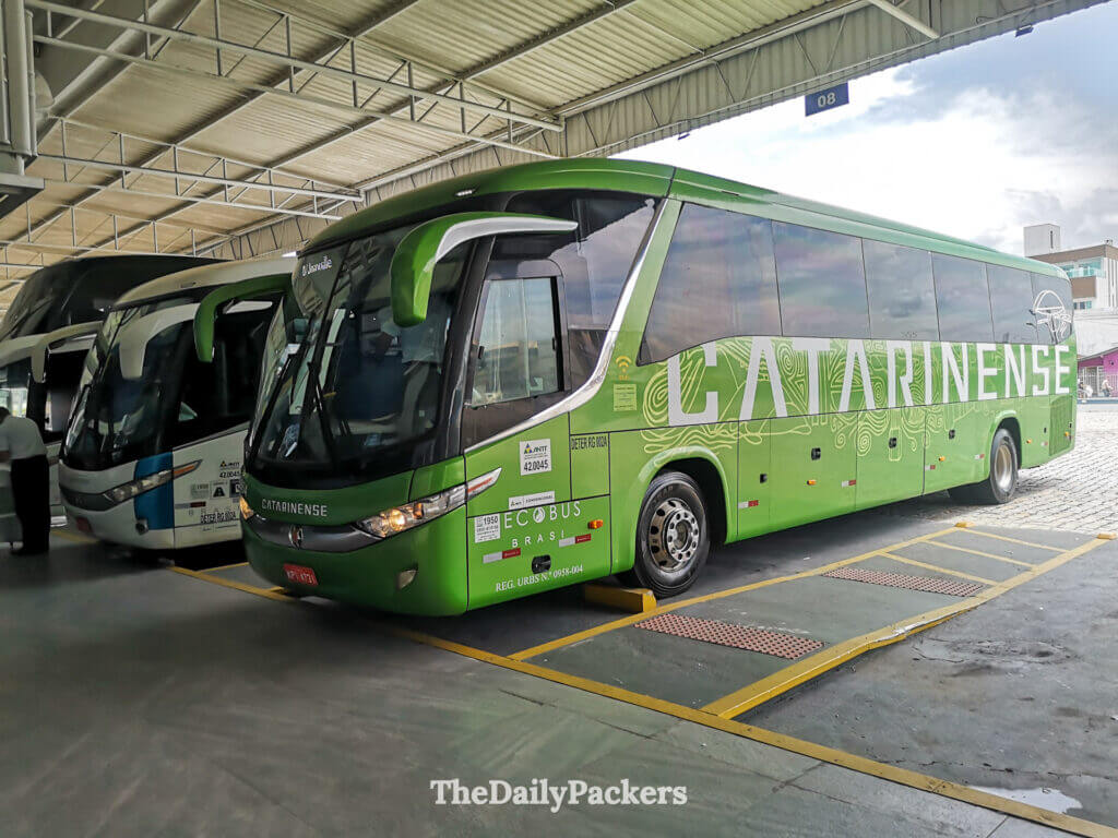 Green Catarinense long-distance bus at the terminal, a common and reliable way to travel from Balneário Camboriú to Florianópolis
