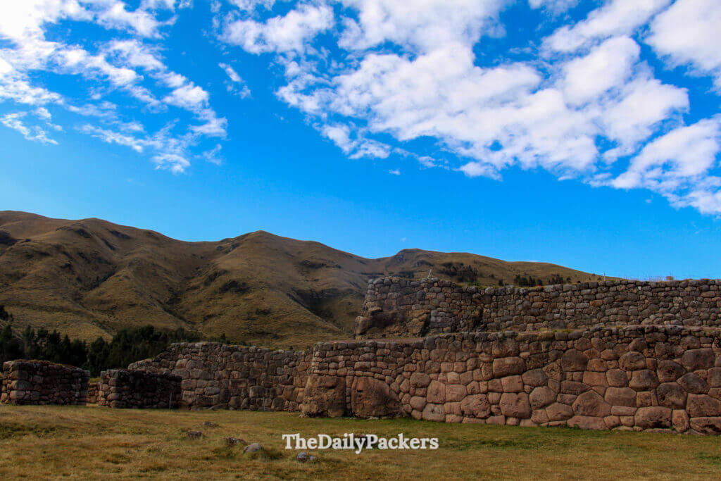 Stone fortifications of Puka Pukara with the rugged Andean mountains in the background, showing the strategic location of this Inca outpost.