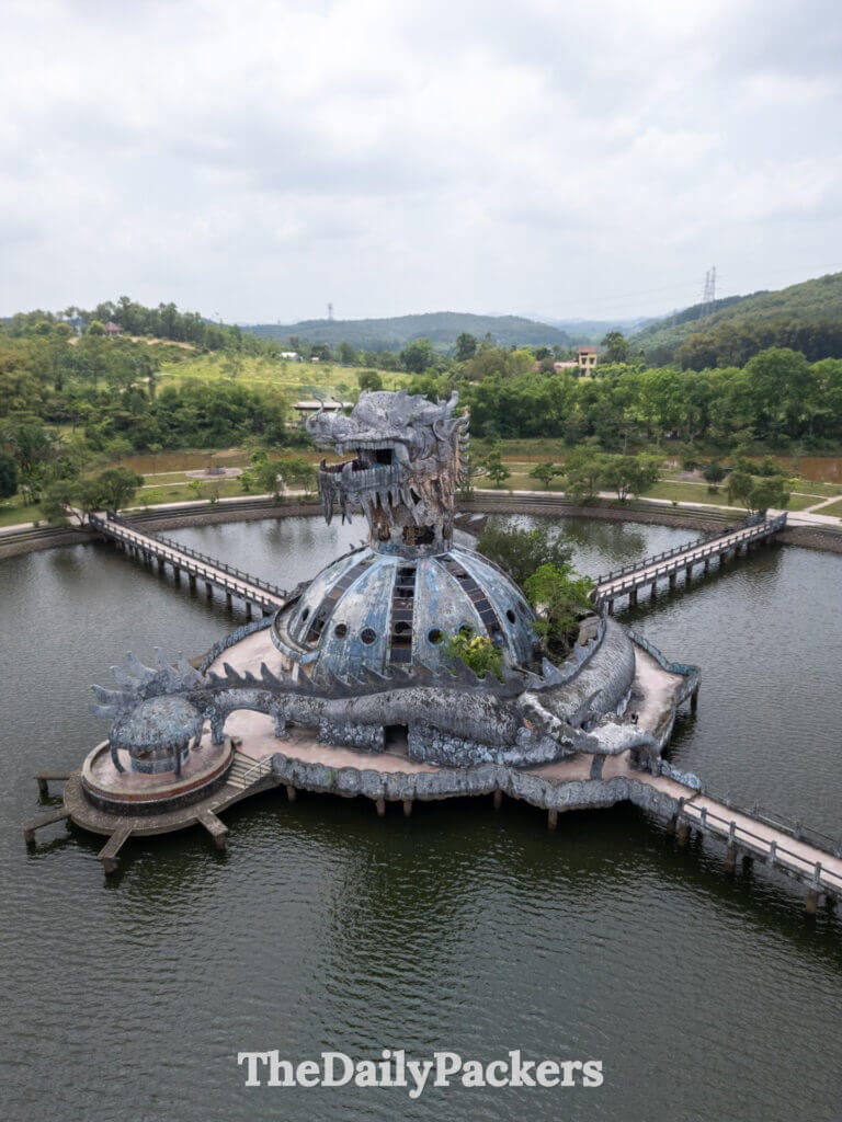 Drone perspective of the Thuy Tien dragon seen from above and to the side, capturing the structure’s intricate sculpted details and curved walkways.