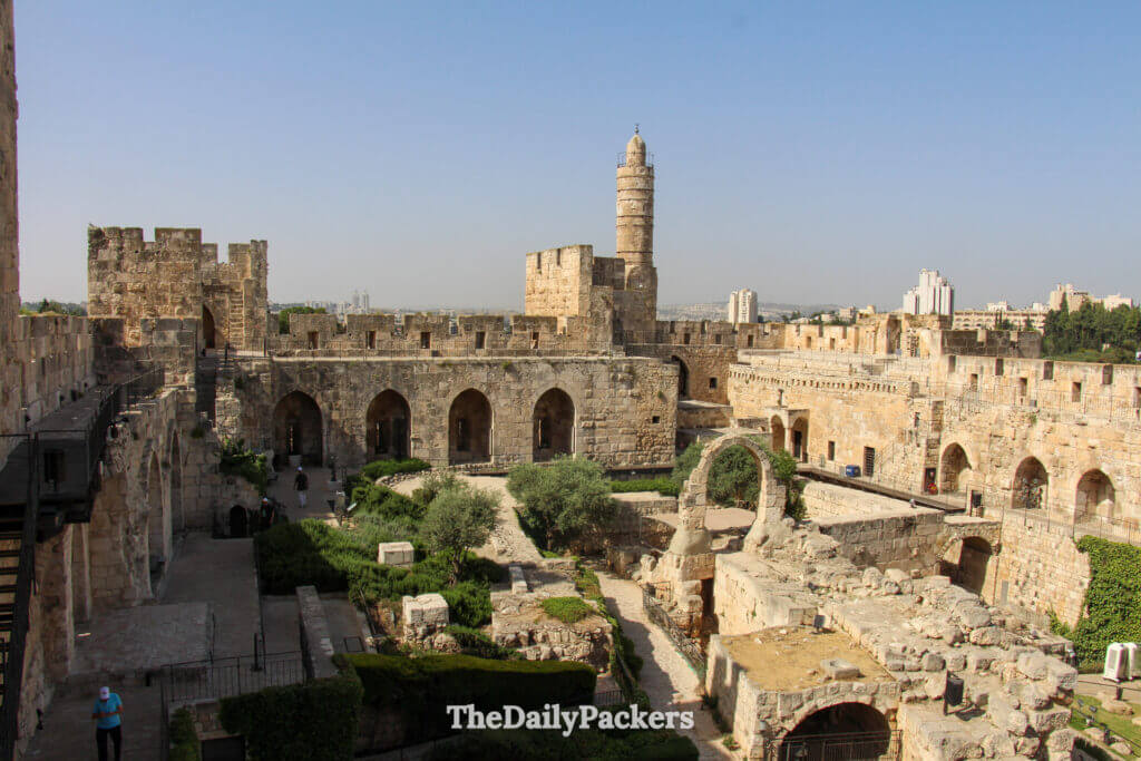 Courtyard and stone walls of the Tower of David Citadel in Jerusalem, showcasing layers of historic architecture