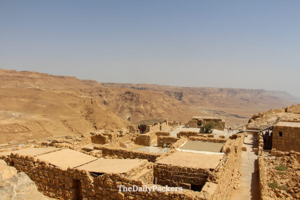 Ancient stone structures and ruins at Masada National Park overlooking the dramatic desert landscape