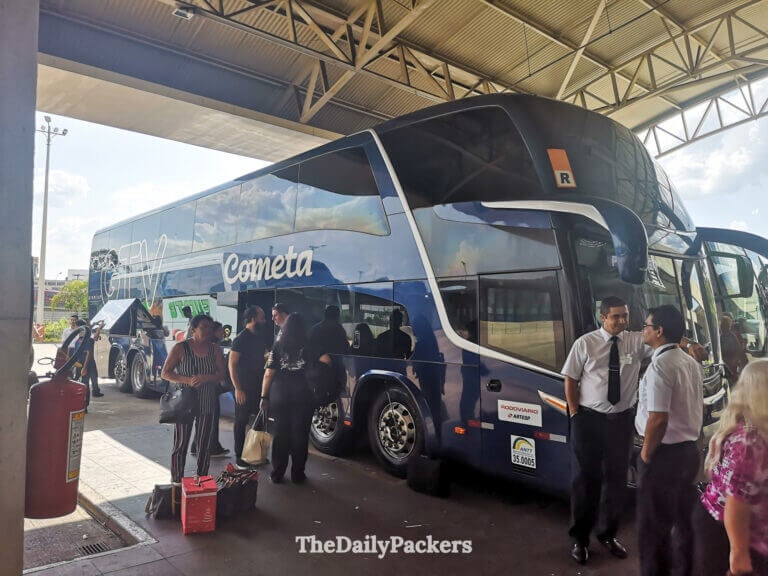 Cometa double-decker bus at the terminal in Curitiba with passengers unboarding for the journey to Curitiba