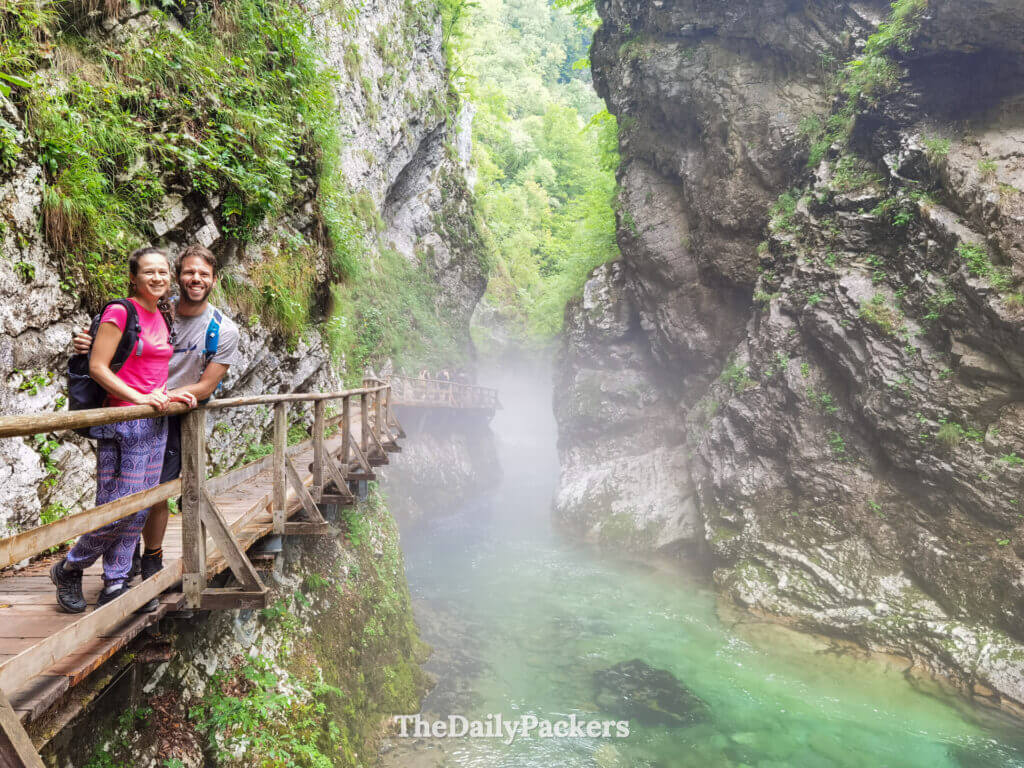 Wooden walkway over turquoise water in Vintgar Gorge, one of the best places to visit in August