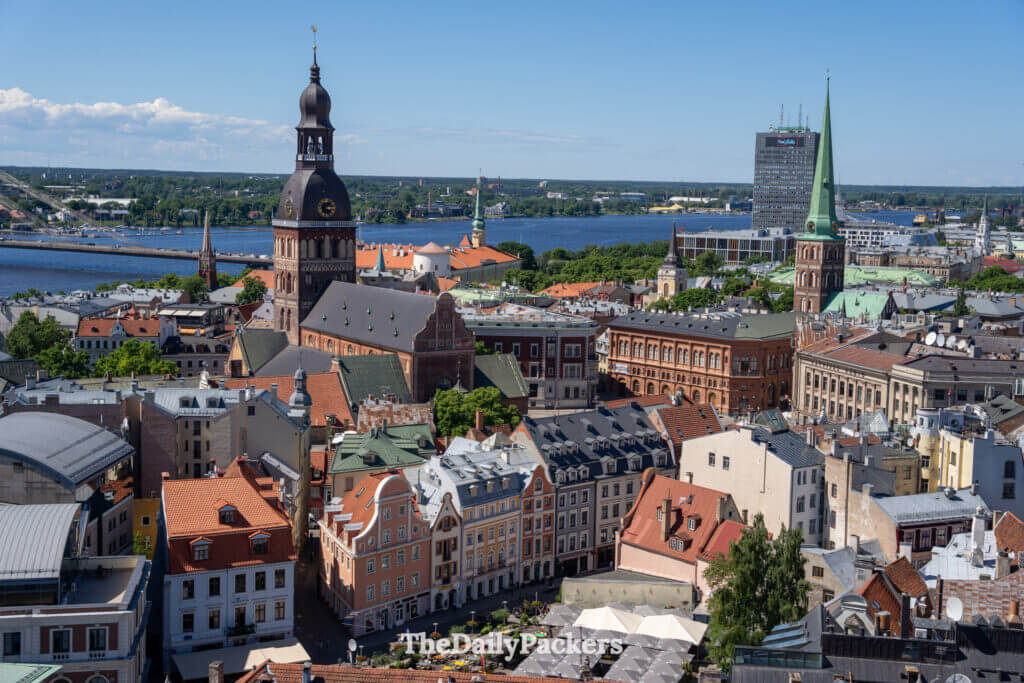Panoramic view over Riga Old Town rooftops and Daugava River on a sunny day