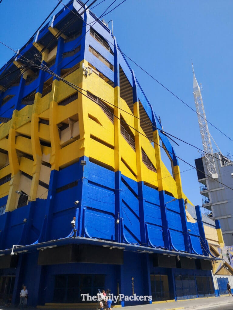 La Bombonera stadium in La Boca, Buenos Aires, painted in Boca Juniors’ blue and yellow colors, seen from the street.