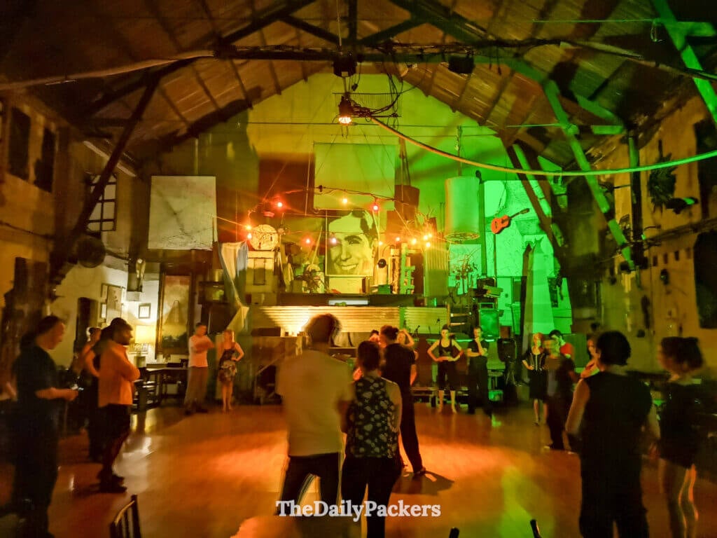 Tango dance night at La Catedral Club in Buenos Aires, with dancers gathered under warm lights inside the historic venue