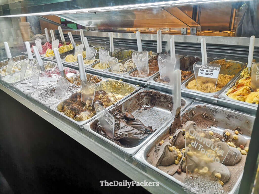 Gelato display at Rapa Nui in Buenos Aires showing artisanal ice cream flavors like dulce de leche, chocolate, and peanut, a local favorite.