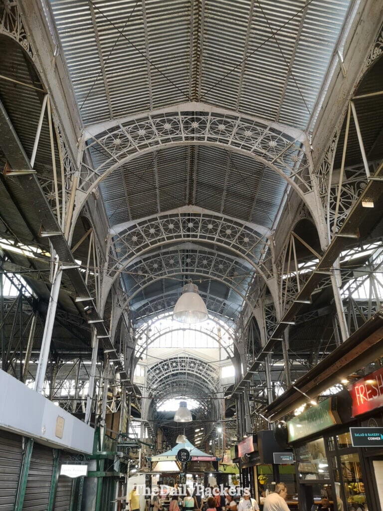 Interior of Mercado de San Telmo in Buenos Aires, with iron architecture, food stalls, and local shops inside the historic market.