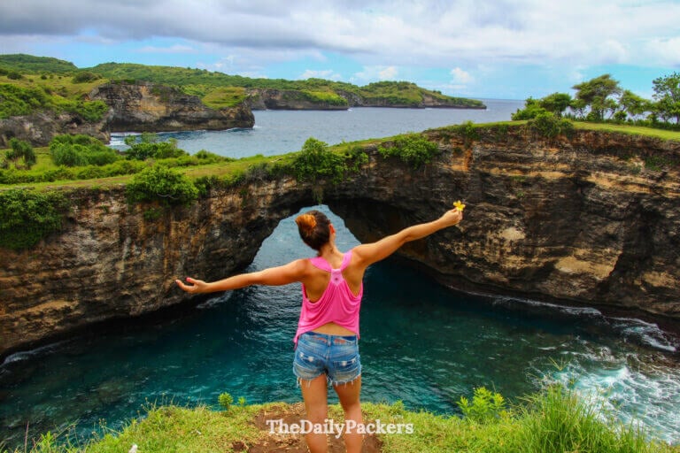 Traveler overlooking Angel’s Billabong natural rock pool on Nusa Penida island, one of the best places to visit in February