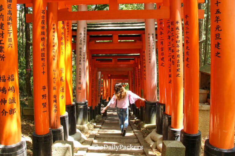 Walking through the red torii gates at Fushimi Inari Taisha shrine in Kyoto, one of the best places to visit in April