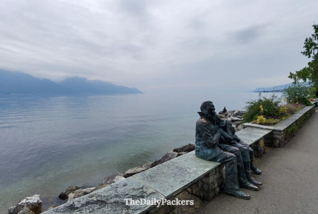 Montreux promenade along Lake Geneva with sculpture and mountain views