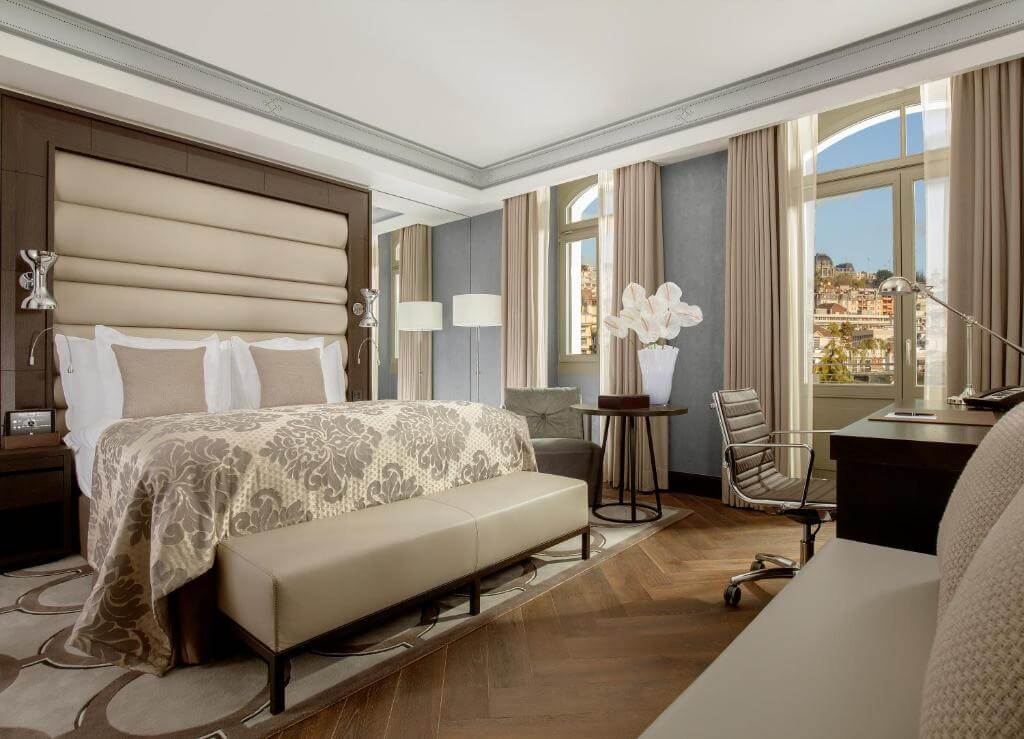 Luxury room at Royal Savoy Hotel Lausanne with city views and upscale furnishings