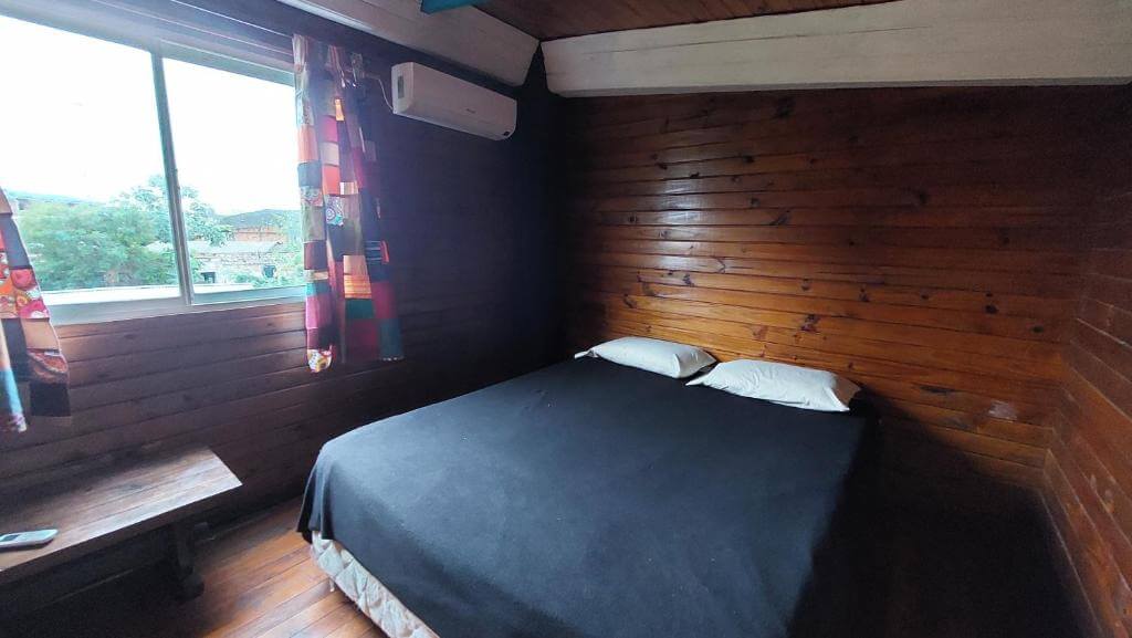 Simple wooden room at The Host hostel in Puerto Iguazu, Argentina