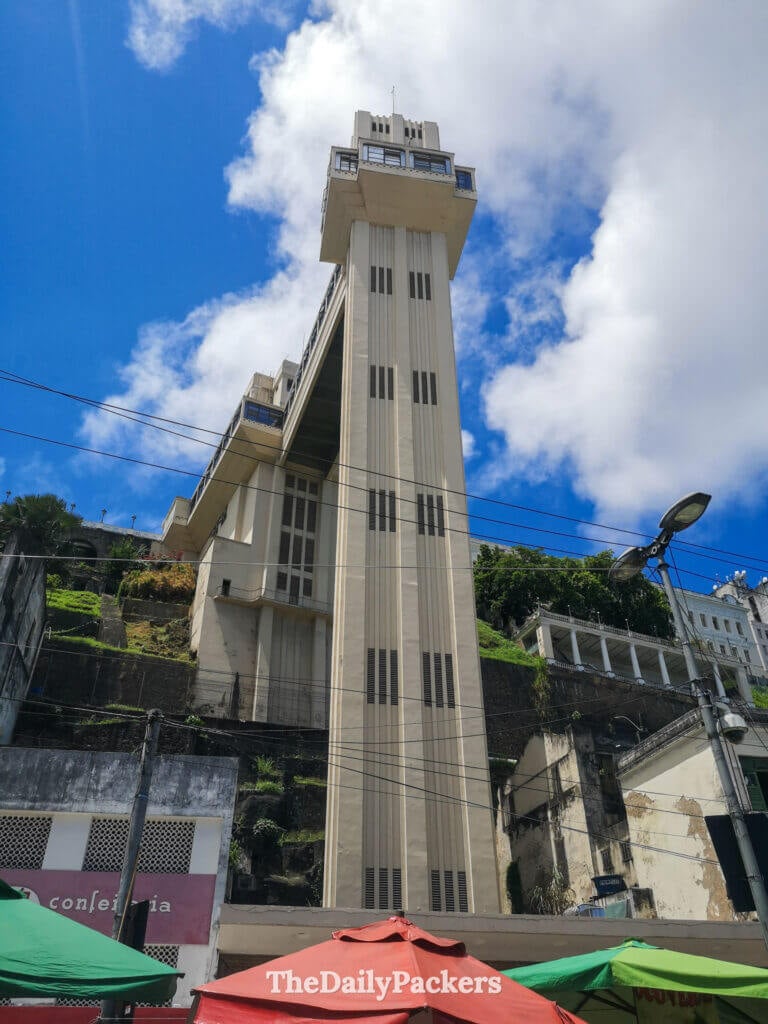 Elevador Lacerda in Salvador connecting the upper and lower city, seen from below against a bright blue sky